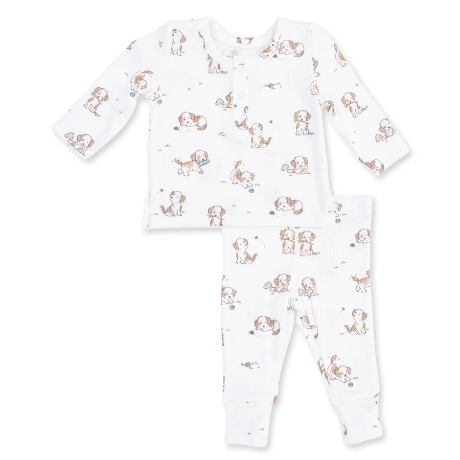 print of little puppies playing on a white baby outift