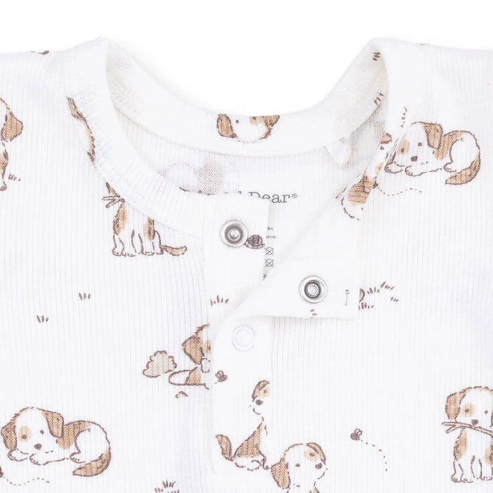 Baby onesie with dog pattern on a white background