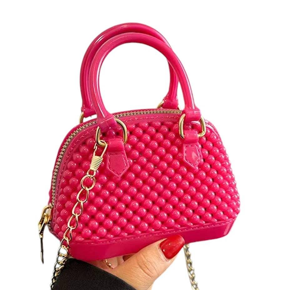 mini jelly bubble bowler in deep pink with gold chain crossbody. 