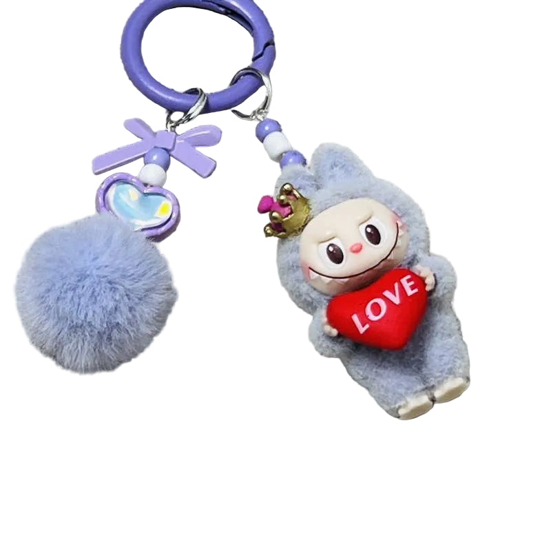 Keychain with plush toy character holding a heart with 'LOVE' text on a textured fabric background
