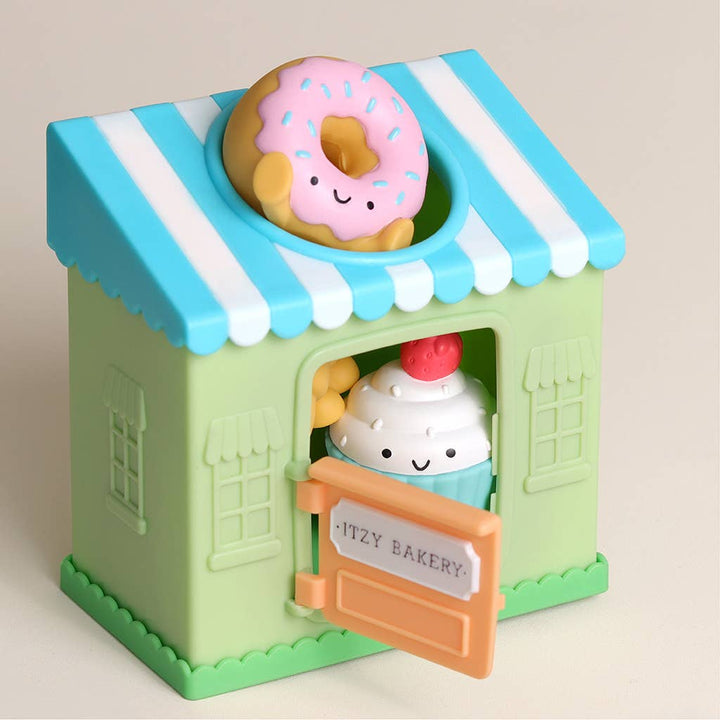 Toy bakery with a donut and ice cream character on a beige background