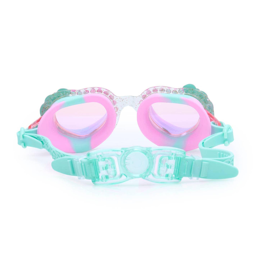 inside of the swim goggles with turquoise strap and pink insides. 