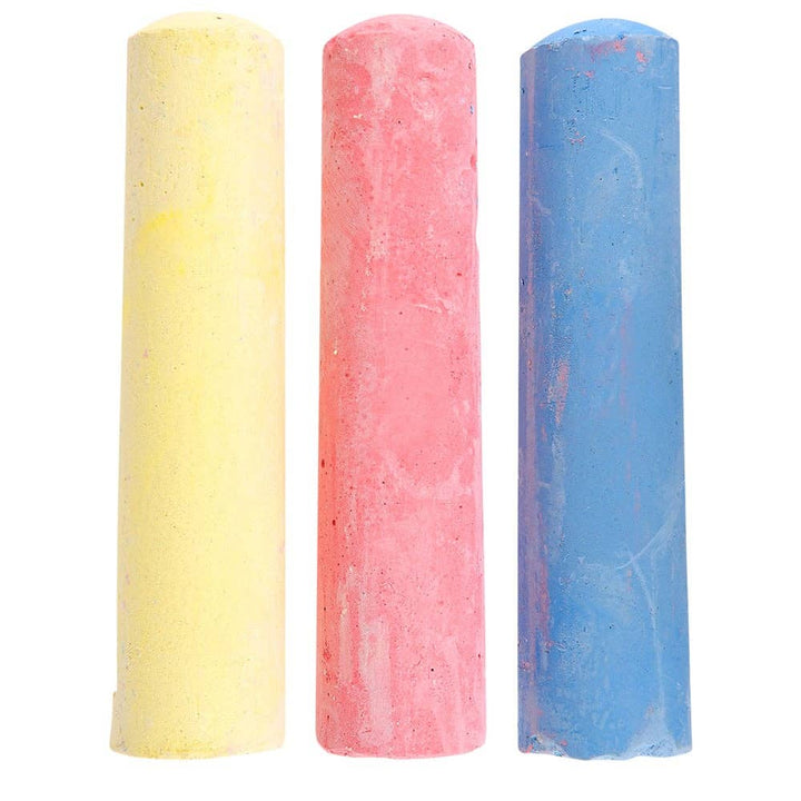 Three cylindrical chalk pieces in yellow, pink, and blue on a white background