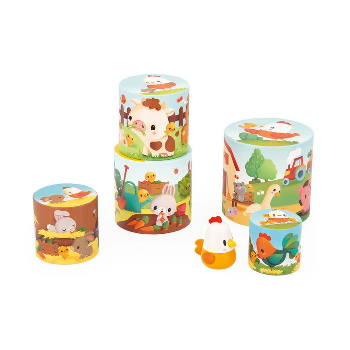 Set of colorful children's cups with farm animal designs on a white background