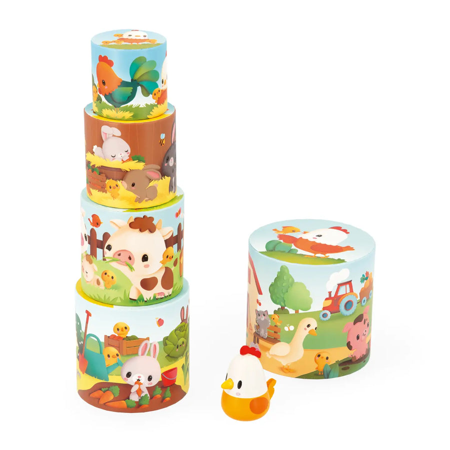 Set of colorful stacked toy containers with farm animal designs on a white background