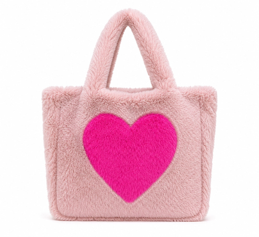 Pink shoulder bag with big magenta heart on the front. 