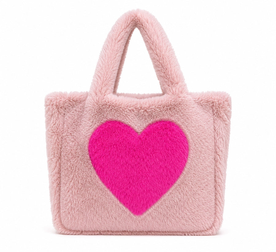 Pink shoulder bag with big magenta heart on the front. 