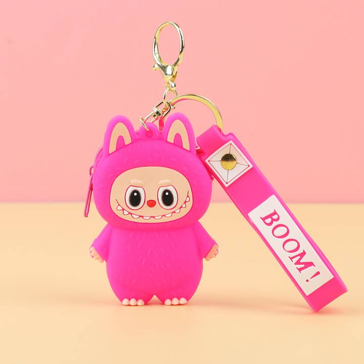 hot pink labaubu change purse with gold keychain fastener