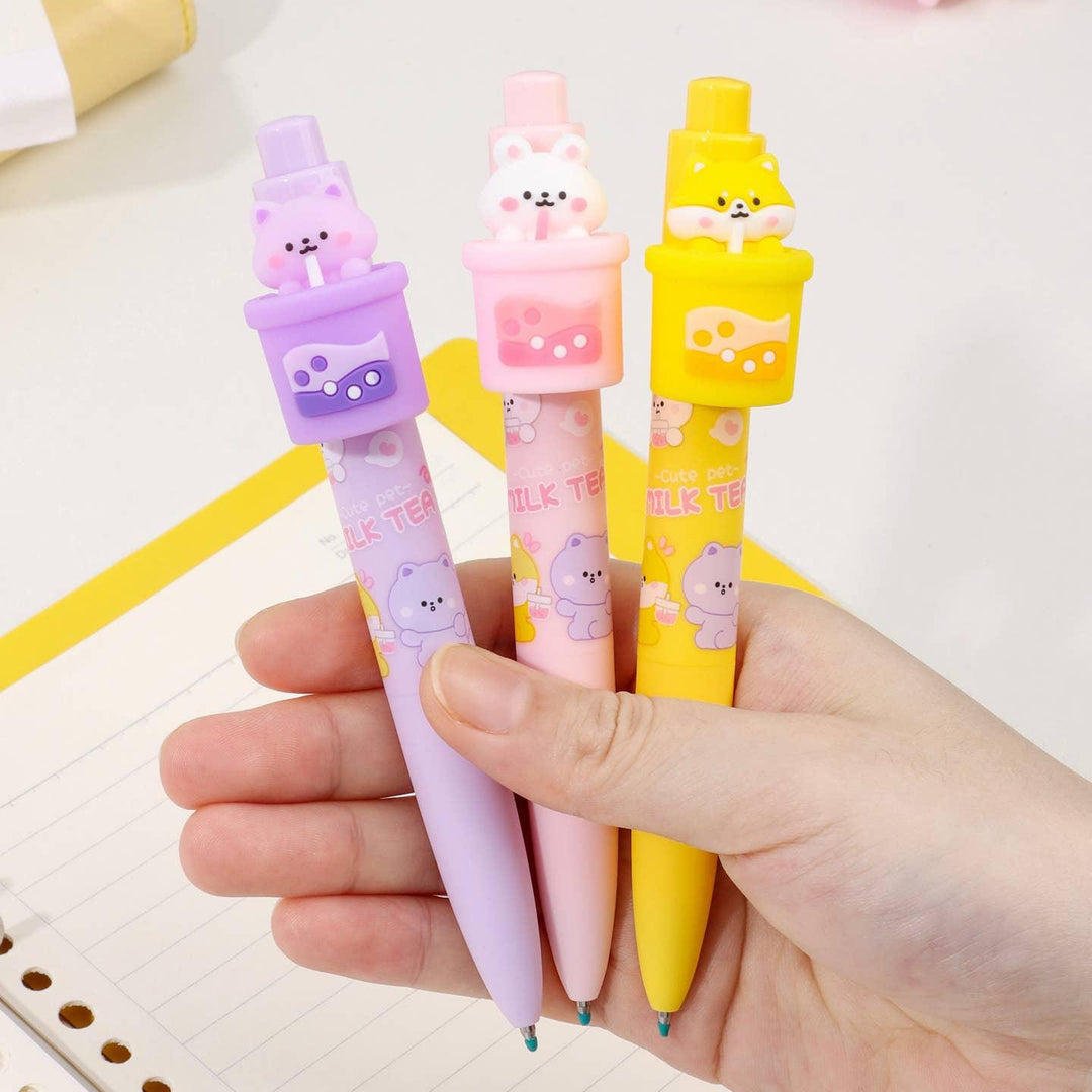 close up of the boba pens and cat on top of the boba in pink, yellow and purple colors. 