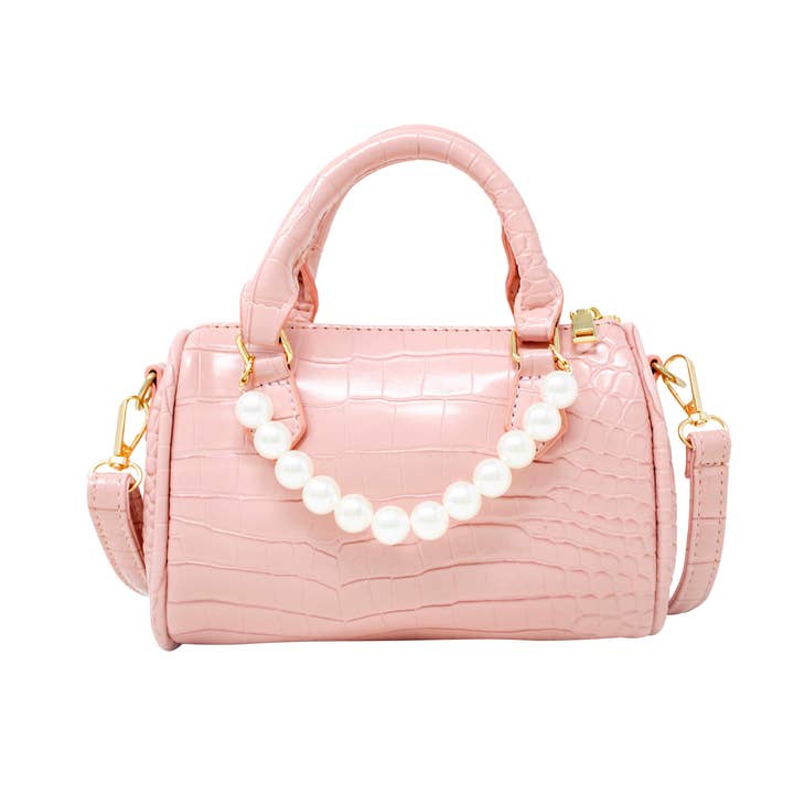 light pink crocodile duffle bag with pearl attachment and handle. Crossbody strap is detachable 