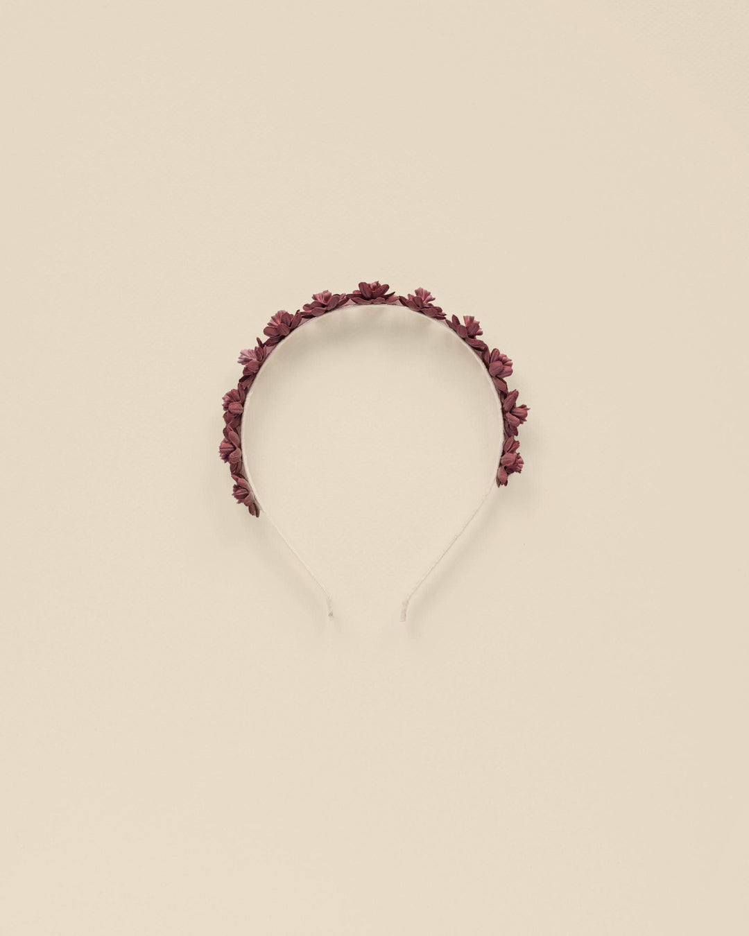 girls headband with burgundy roses atop the headband. 