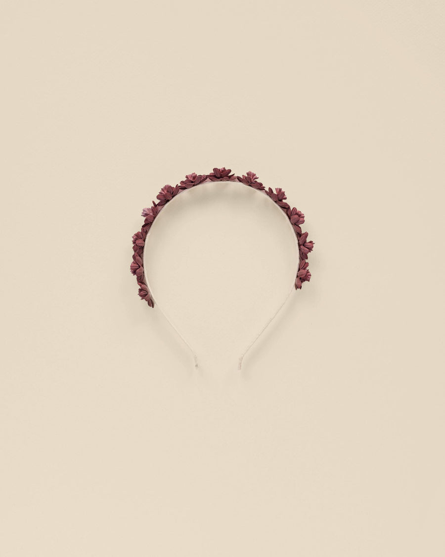 girls headband with burgundy roses atop the headband. 