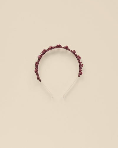 girls headband with burgundy roses atop the headband. 