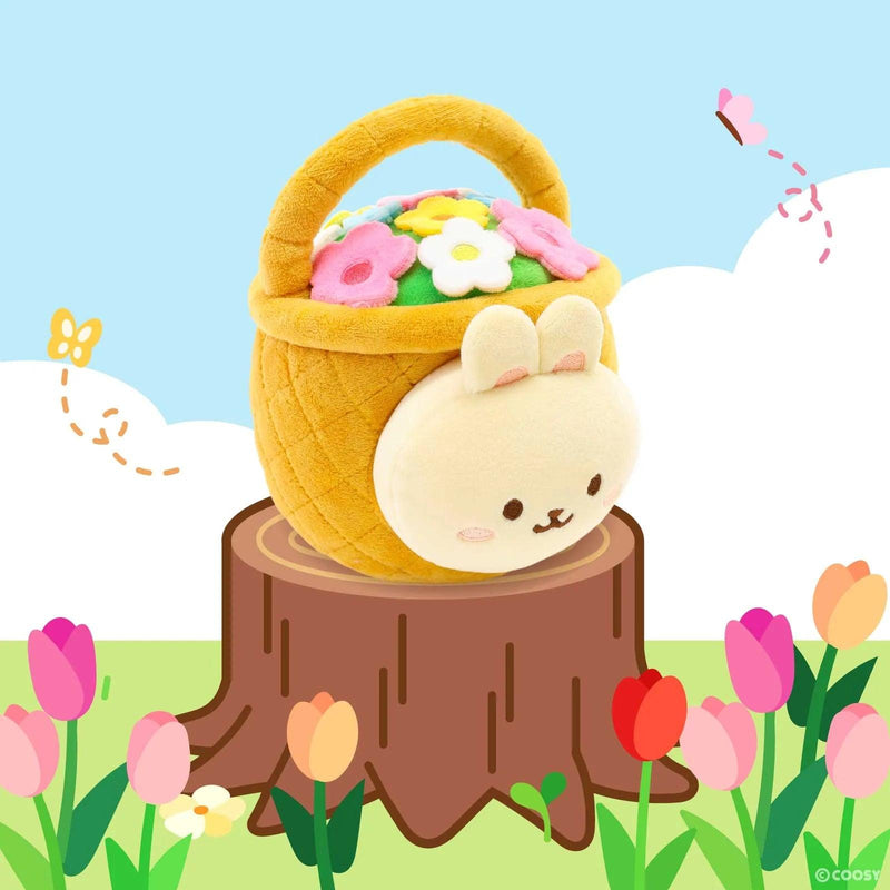 Squishy bunny wearing a flower basket as an outfit. Bunny fits inside the basket. The basket is adorned with tiny flowers on top. Bunny and basket can be detached. 