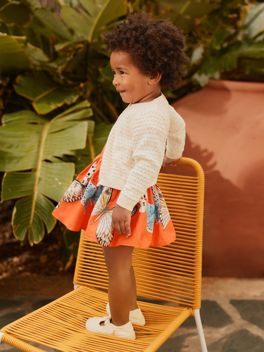 baby wearing the butterfly dress 