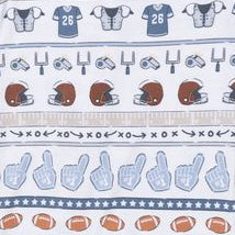 close up of the print on the footie. stripes of football patterns: helmets, footballs and jerseys. 
