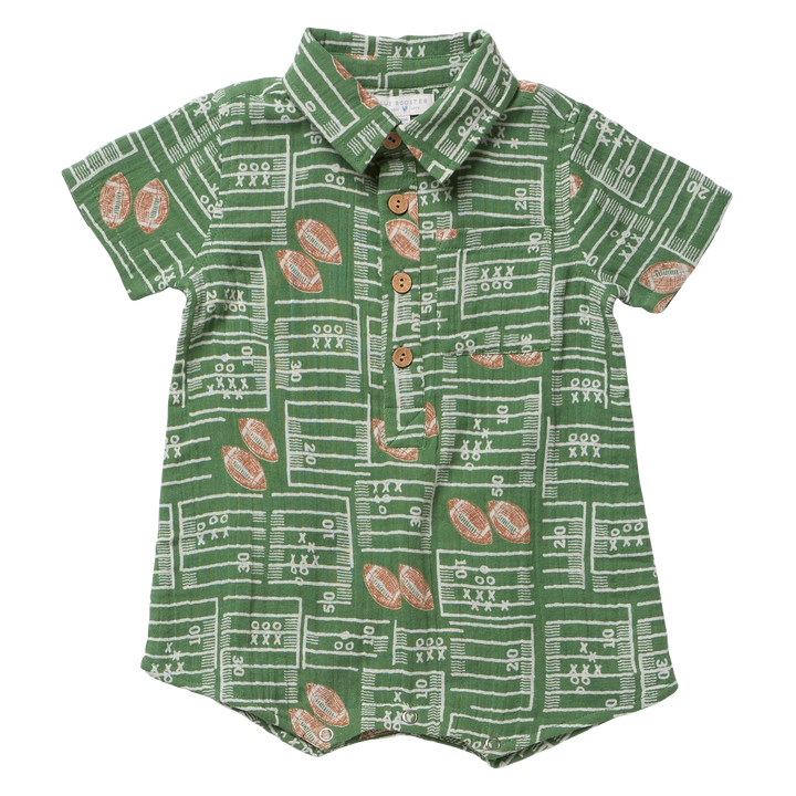 A baby short-sleeve button-up romper in green with a white football field line pattern and brown football motifs, featuring a pointed collar and brown buttons.