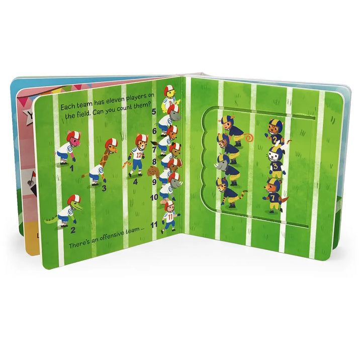 An open children's pop-up book showing a football-themed page with illustrated players on a green field and a pop-up window on the right side.