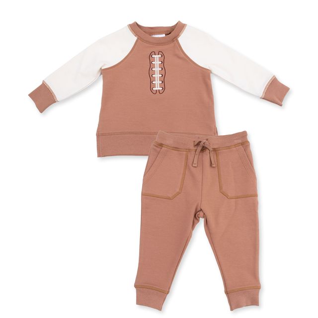 french terry two piece sweat set in mostly brown with creme sleeves.  football laces down the middle of the sweatshirt. 