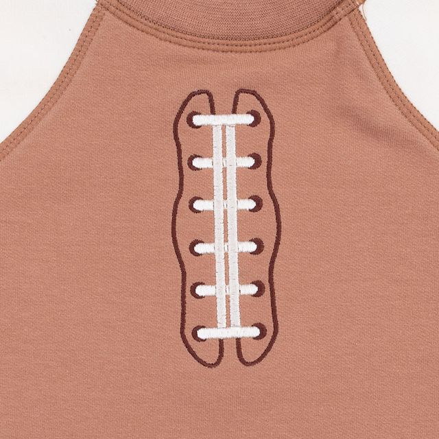close up of the embroidered laces on the sweatshirt. 