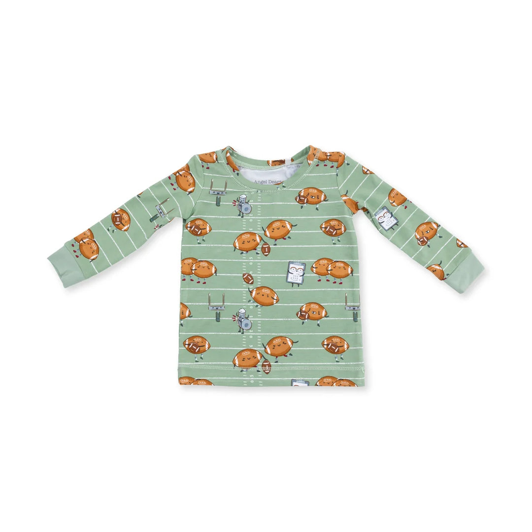 Children's long-sleeve shirt with footballs playing football pattern on a white background