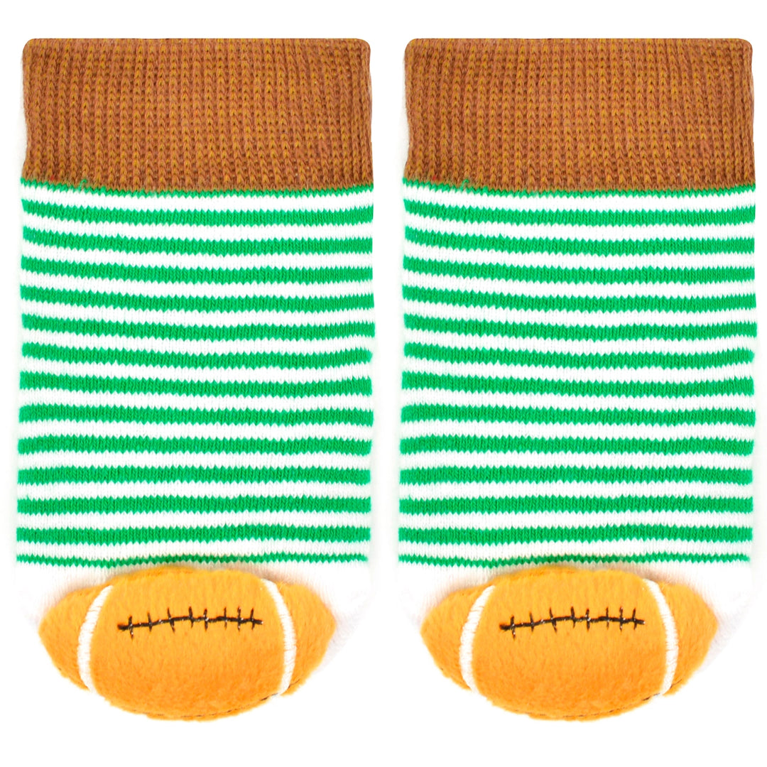 close up of the colors and stripes on the baby socks. the footballs are on the toes. 