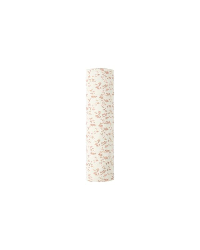 baby swaddle with pink floral print rolled for packaging 