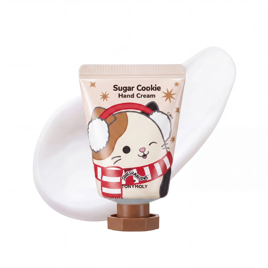 A tube of Tony Holty Sugar Cookie Hand Cream featuring a cute cartoon hamster wearing a red and white striped scarf and ear muffs, set against a white background with a white hand cream smear behind it.