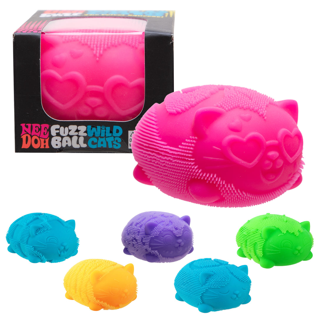 A set of Nee Fuzz Wild Ball Cats toys in multiple colors, including a large hot pink cat-shaped ball with a heart-shaped face and textured bristles, shown alongside its black retail box and five smaller ball toys in blue, purple, yellow, and green on a white background.