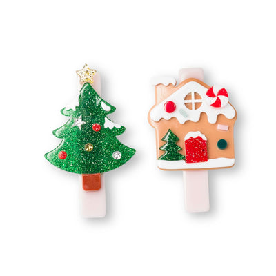 set of alligator clips: one christmas tree that is sparkly and one gingerbread house with snow on the top