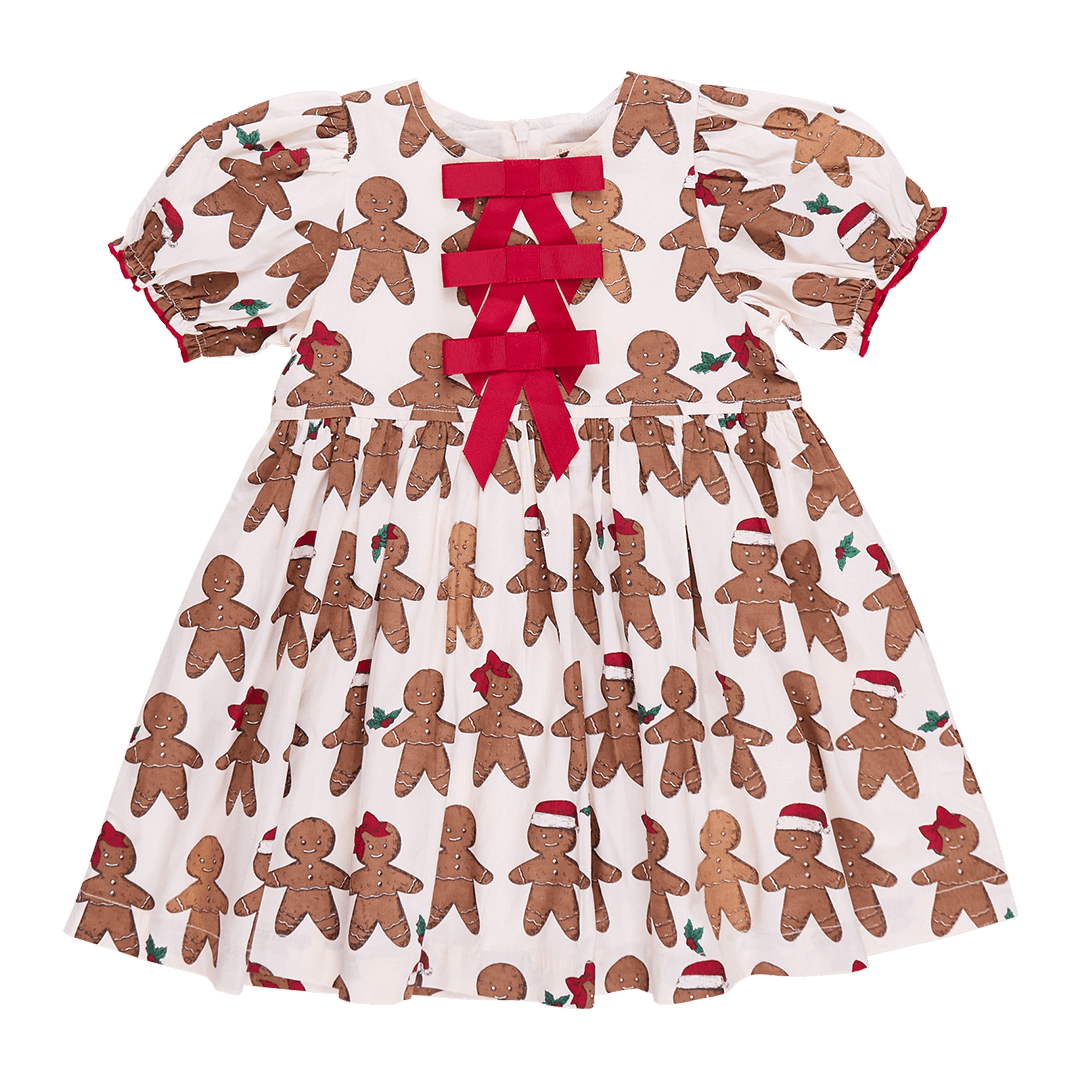 gingerbread cookies on the dress. little boy and little girl 3 red bows down the center of the upper chest of the dress. 