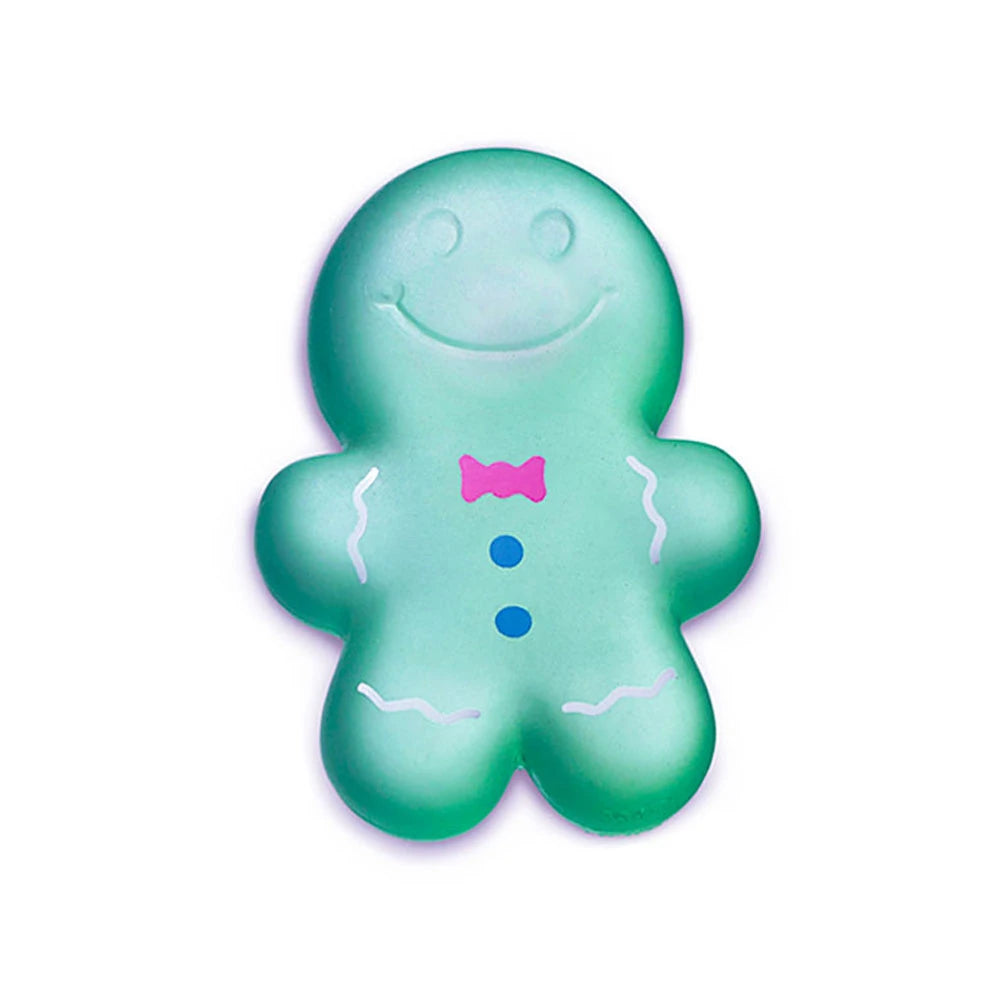 Green gingerbread man-shaped toy with a bow tie on a white background
