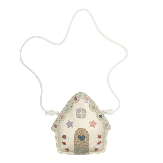 Decorative gingerbread house-shaped pouch with a string on a white background