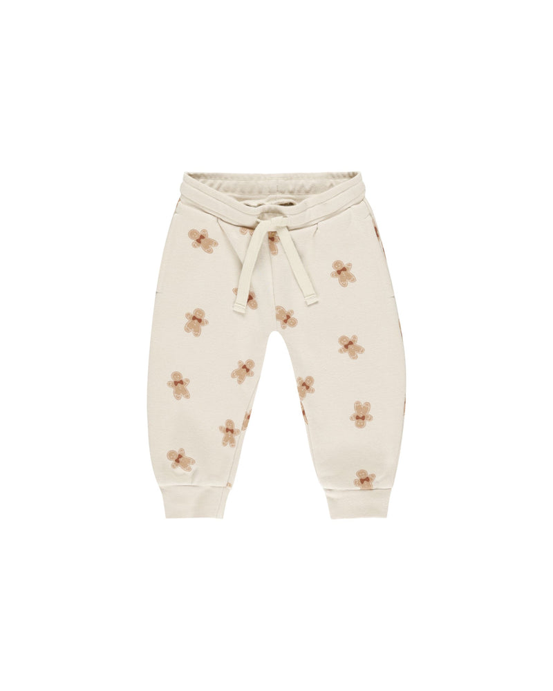 beige joggers with small ginger bread people on it 