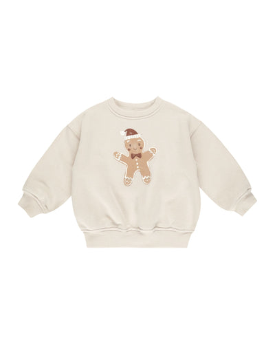 beige sweatshirt with big gingerbread man on the front. 