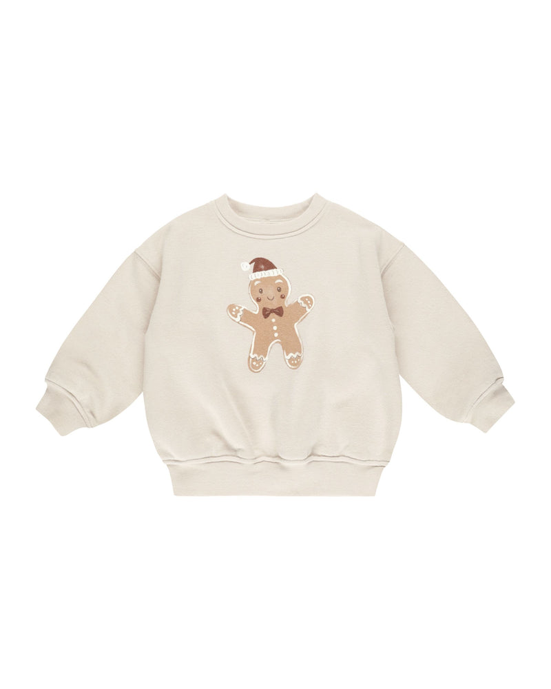 beige sweatshirt with big gingerbread man on the front. 