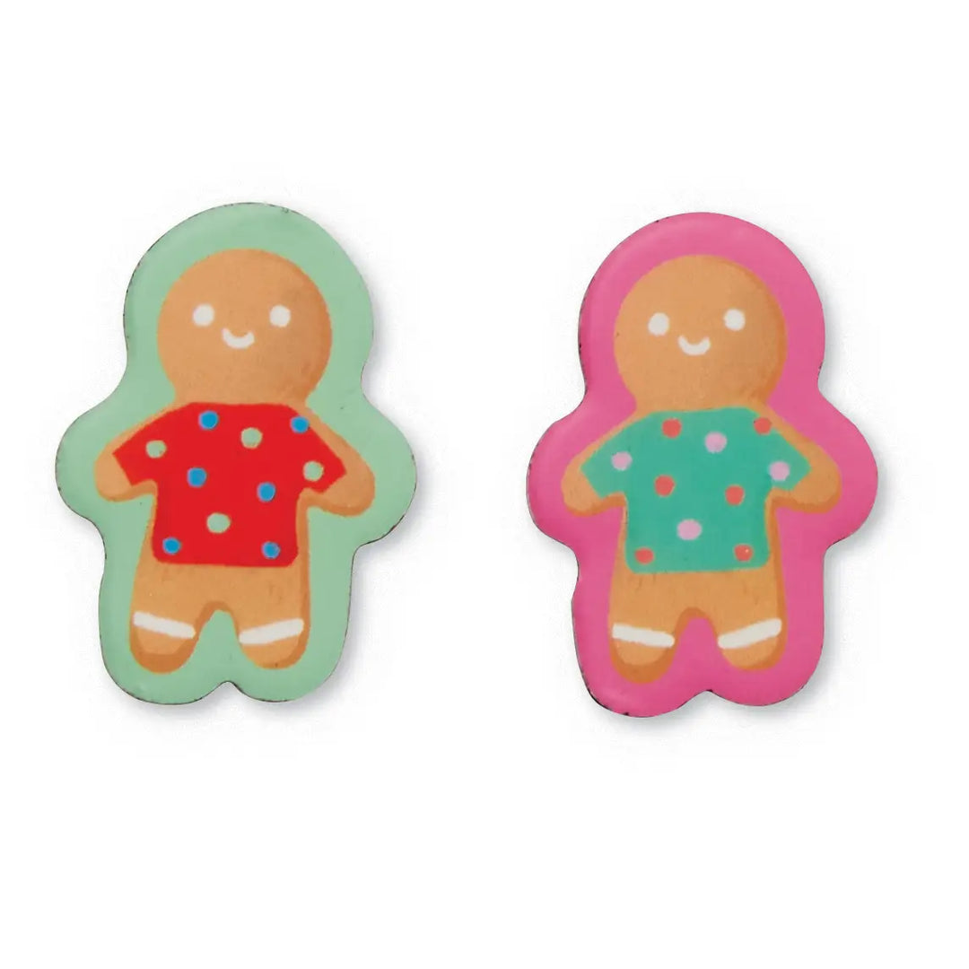 Two gingerbread person-shaped items on a plain white background, one outlined in mint green with a red shirt and blue and pink polka dots, and the other in pink with a green shirt and orange and pink polka dots.