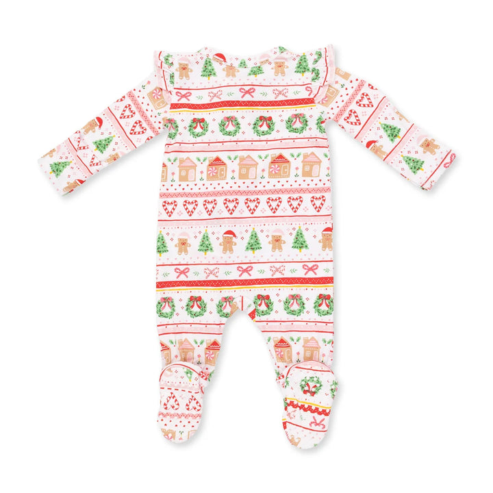 A baby footed sleeper with long sleeves and attached feet, featuring a festive Christmas Fair Isle pattern with gingerbread houses, wreaths, candy canes, and trees on a white background.