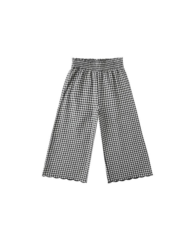 Black and white checkered pants on a white background