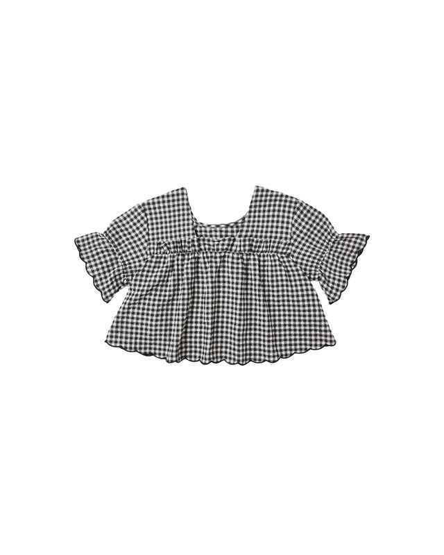 Black and white gingham checkered blouse with ruffled sleeves on a white background