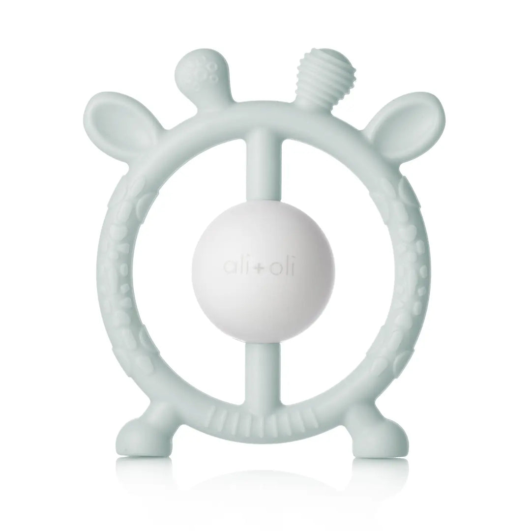 Teething ring with a ball in the center on a white background