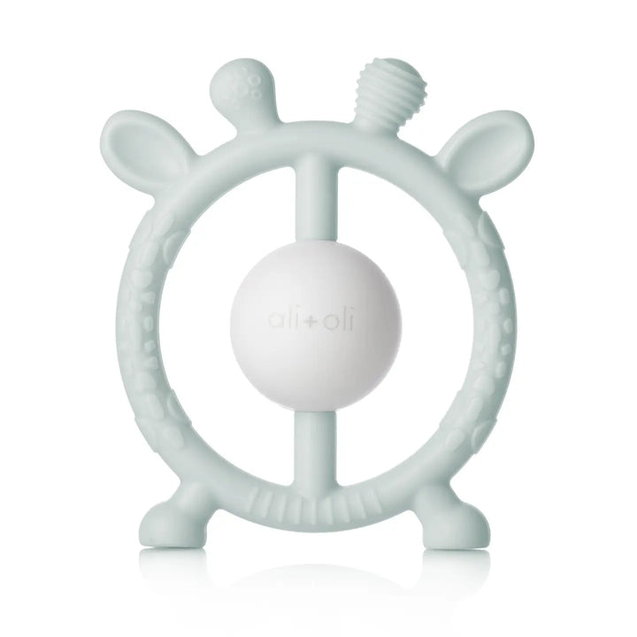 Teething ring with a ball in the center on a white background