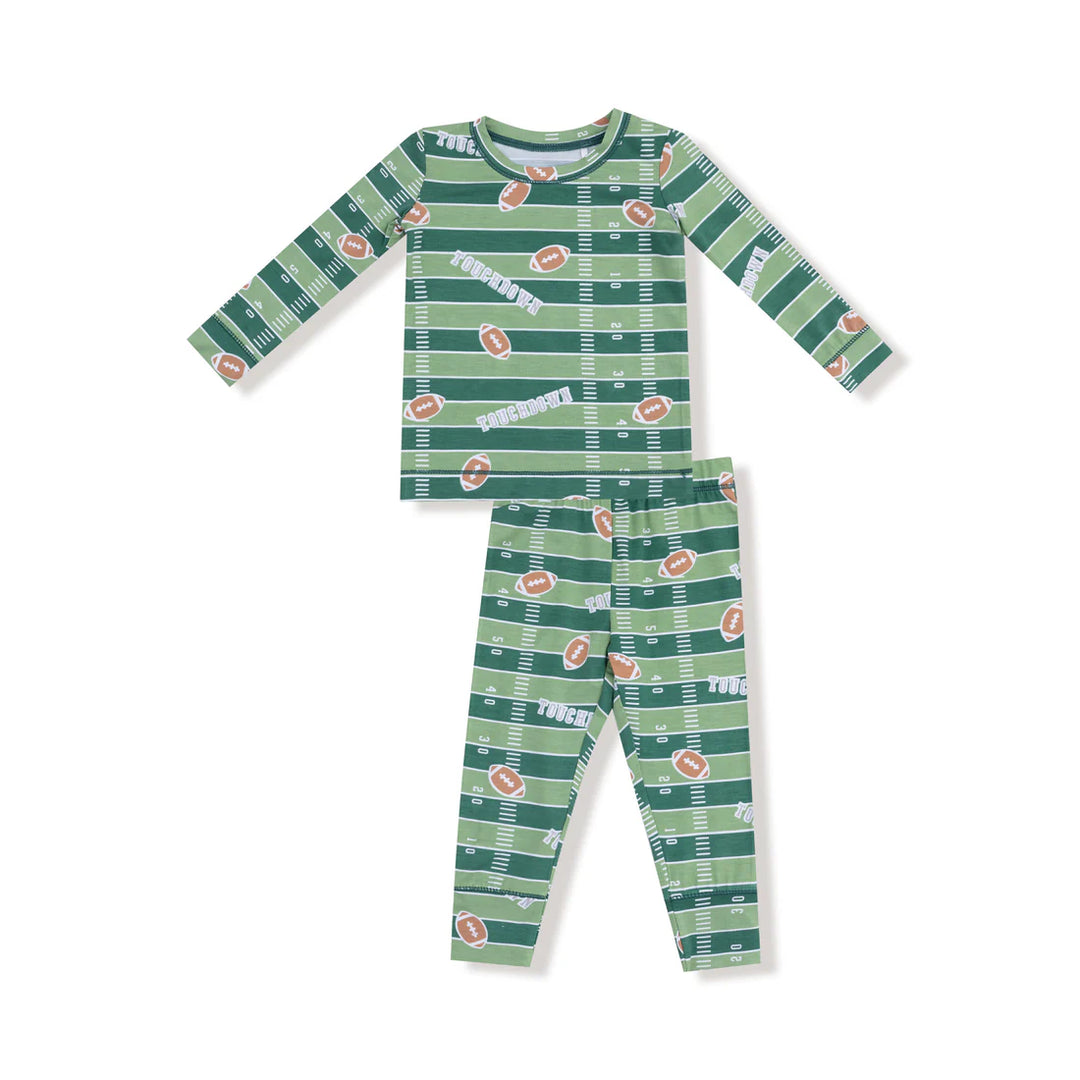 Green pajama set with football pattern on a white background