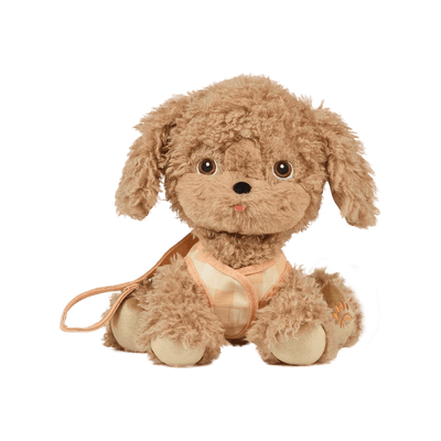 stuffed animal dog that looks like a puppy with floppy ears and golden fur with a lead attached. 