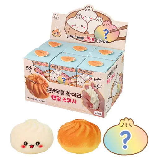 Box of cute cartoon-style dumplings with various expressions on a white background