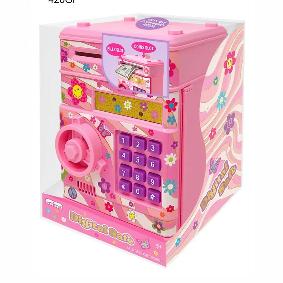 Pink toy digital safe cash in its clear plastic packaging box, decorated with colorful cartoon flowers, smiley faces, and a purple keypad.