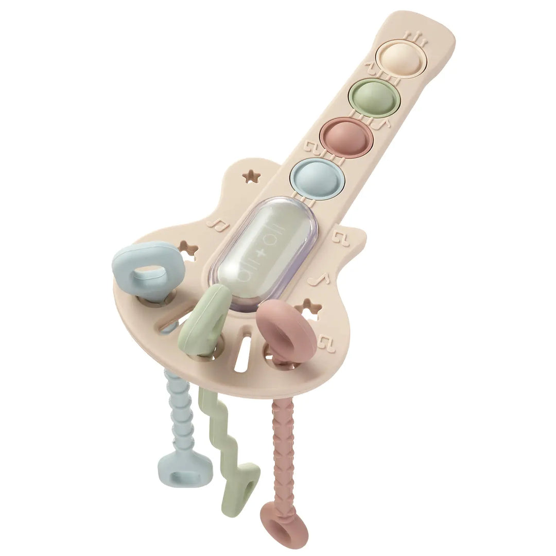 Baby teething guitar with multiple textures on a white background