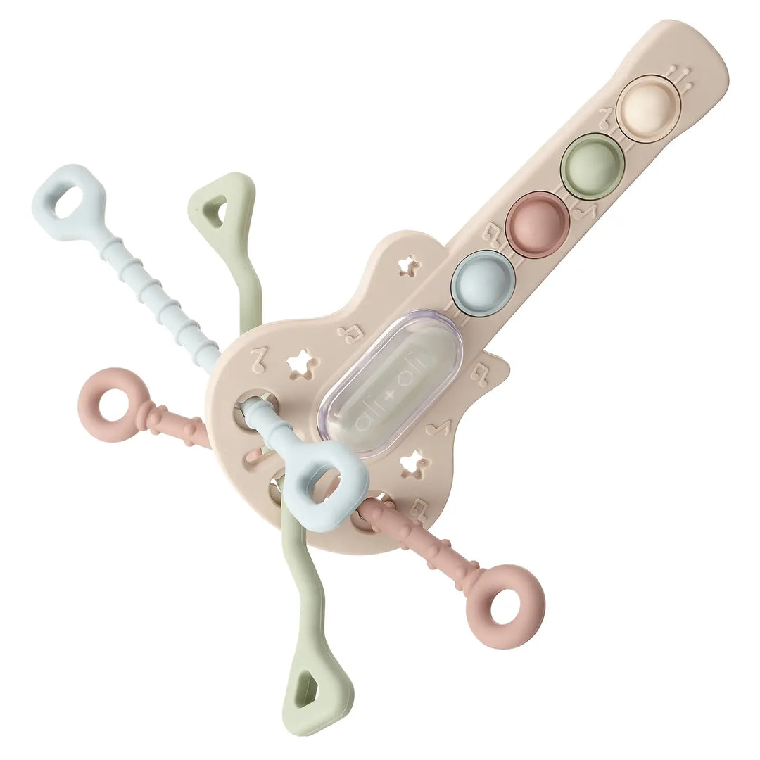 Baby teething toy with multiple components on a white background