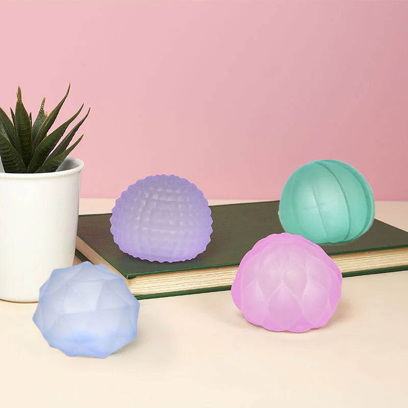 assorted colors of textured aquish balls: pink, blue, teal and purple