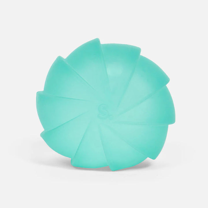 Teal squish ball on a white background
